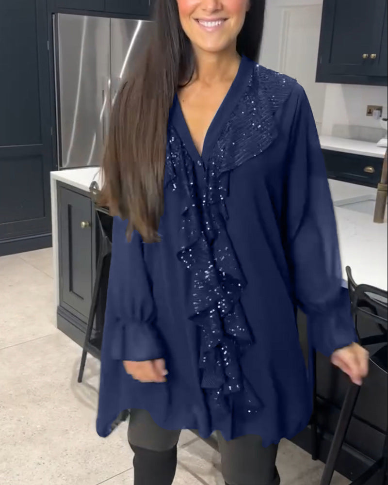 Bluse med volanger og elegant stil