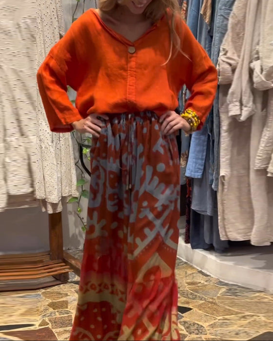 Løse bukser med brede ben med trykt lomme