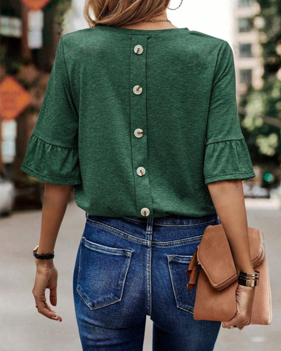 Ensfarget knapp bak elegant topp