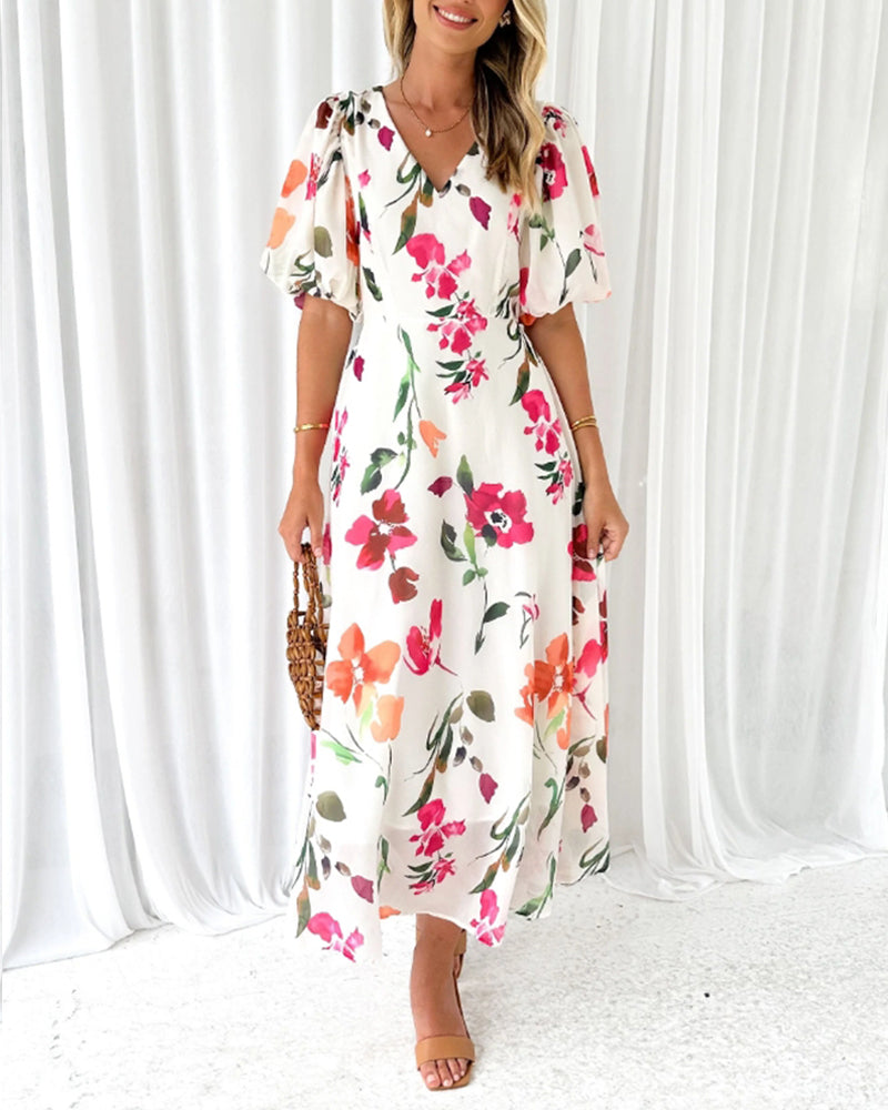 Elegant kjole med puffermer og blomsterprint