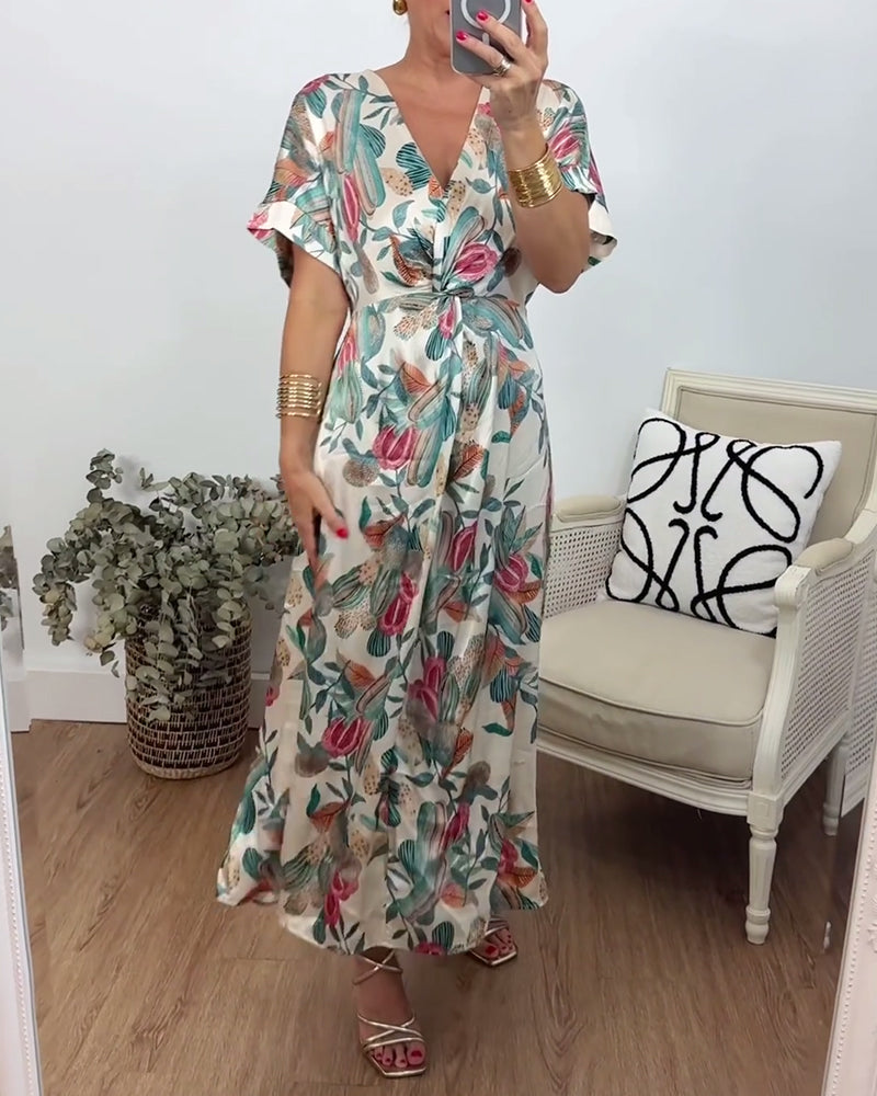 Elegant kjole med v-hals med botanisk trykk