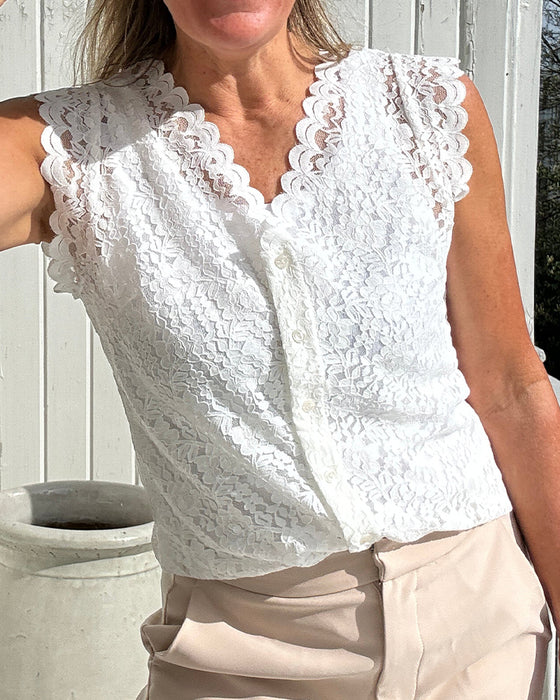 Elegant, ermeløs blondetopp med v-hals