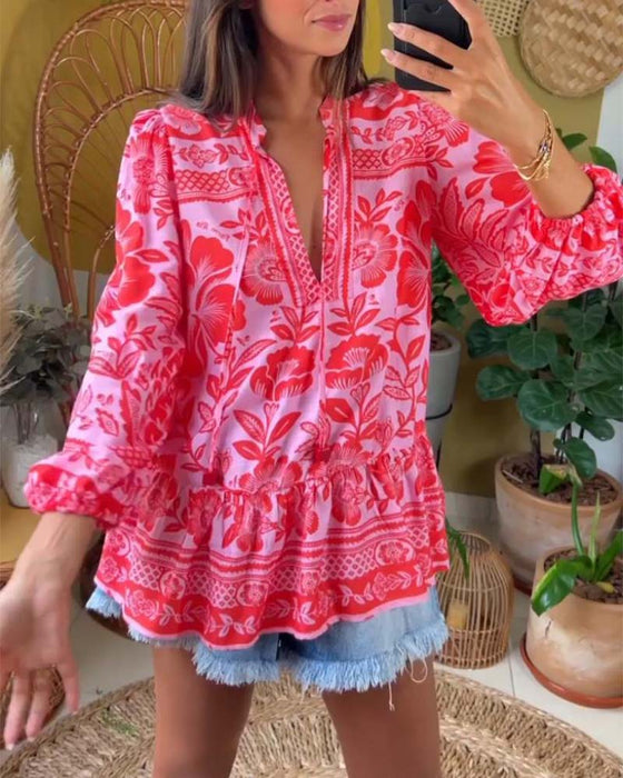 Dyp V-bluse med blomstertrykk
