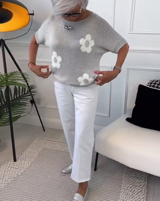 Slank blomstergenser med rund hals