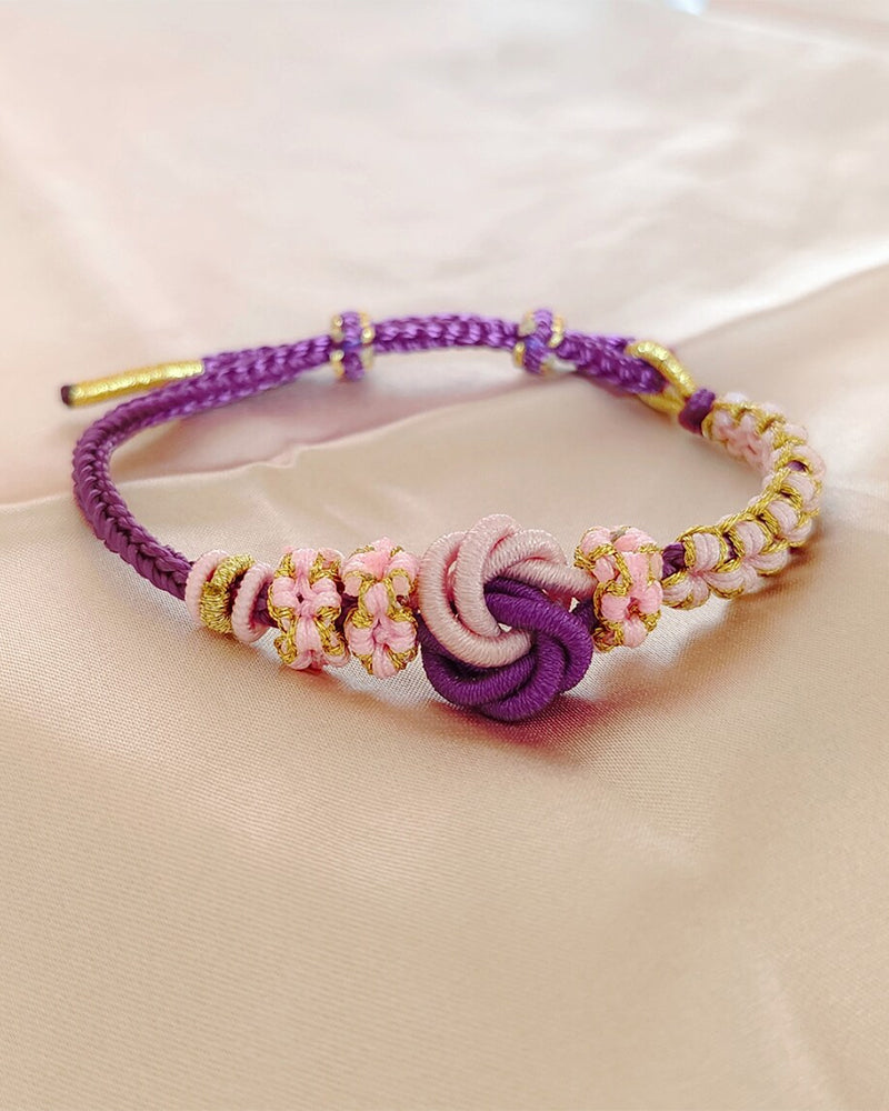 Armbånd med knute av ferskenblomster
