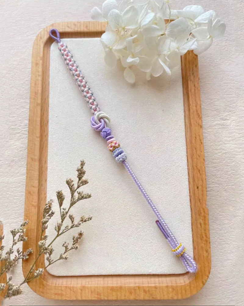 Armbånd med knute av ferskenblomster