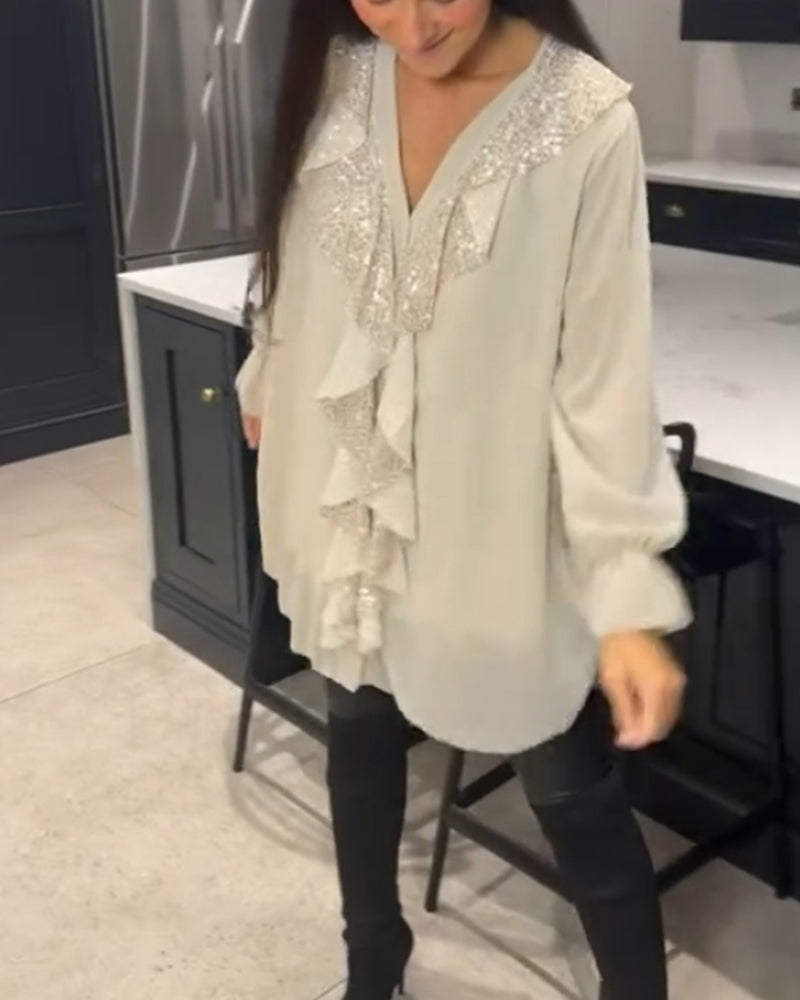 Bluse med volanger og elegant stil