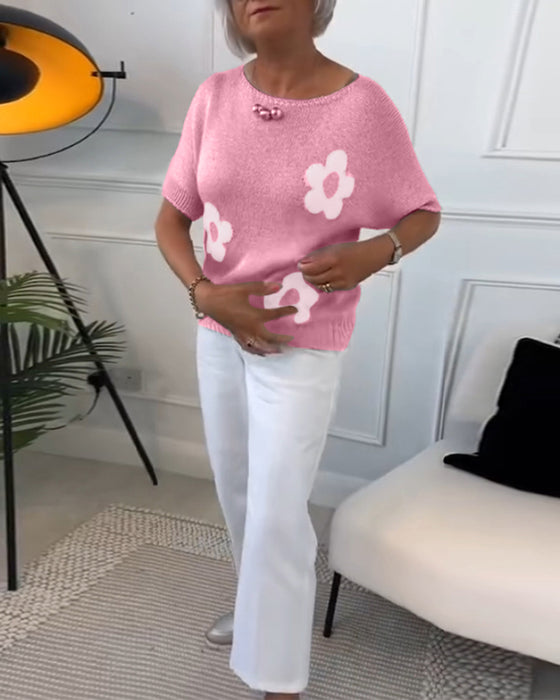 Slank blomstergenser med rund hals