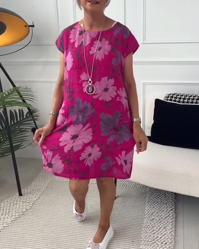 Uformell løs kjole med blomstertrykk med korte ermer og lommer