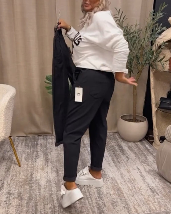 Uformell genser med v-hals med bokstavtrykk