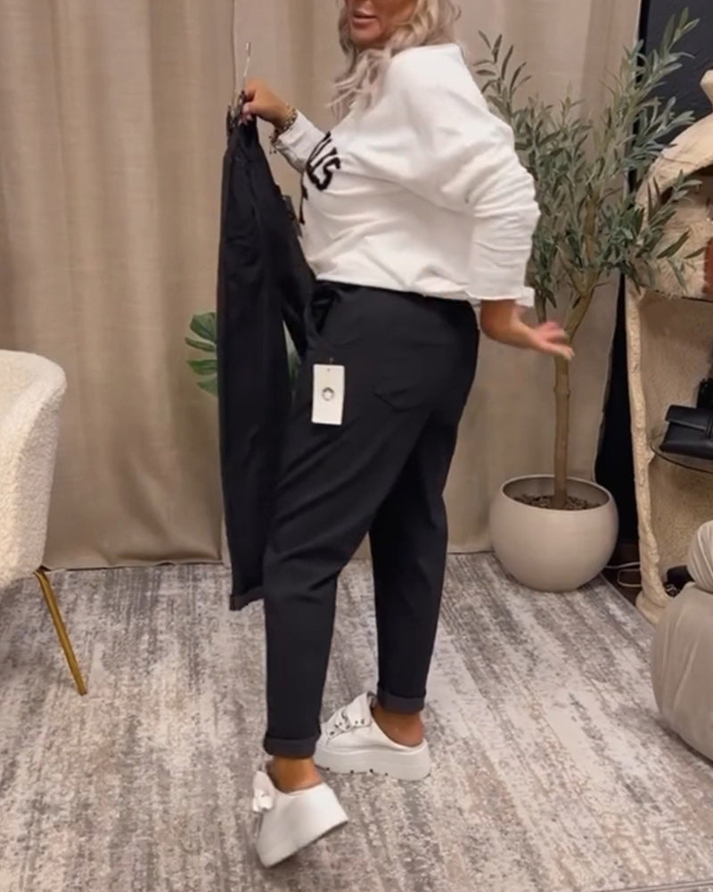 Uformell genser med v-hals med bokstavtrykk