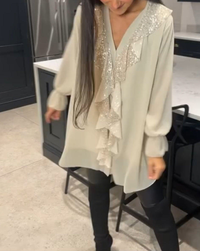 Bluse med volanger og elegant stil