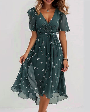 Elegant kjole med V-hals og knytebånd