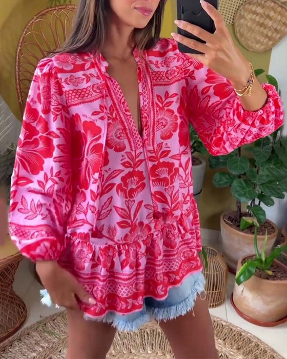 Dyp V-bluse med blomstertrykk