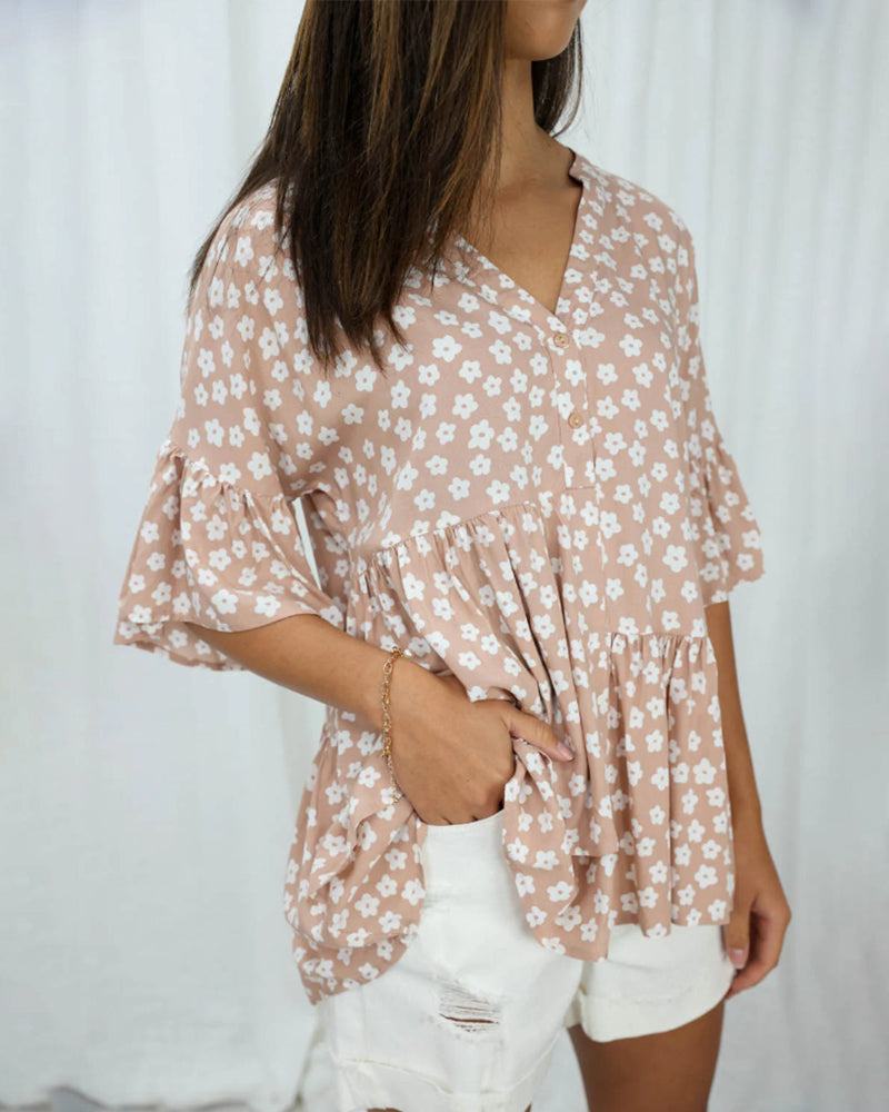 Blomstret bluse med V-hals klokkeermer