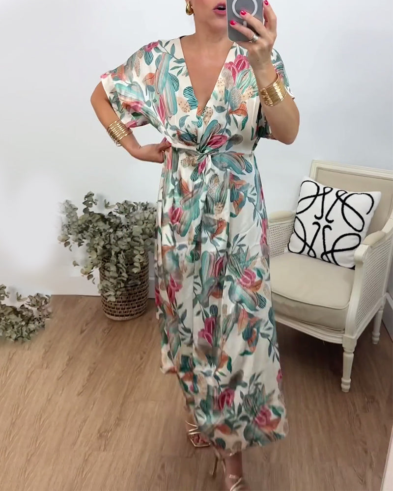 Elegant kjole med v-hals med botanisk trykk