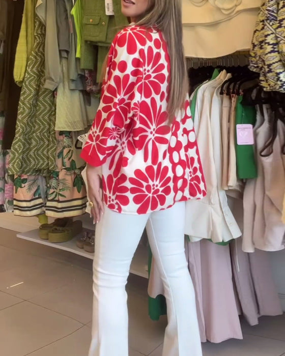 Blomstret bluse med uregelmessig fald med jakkeslag