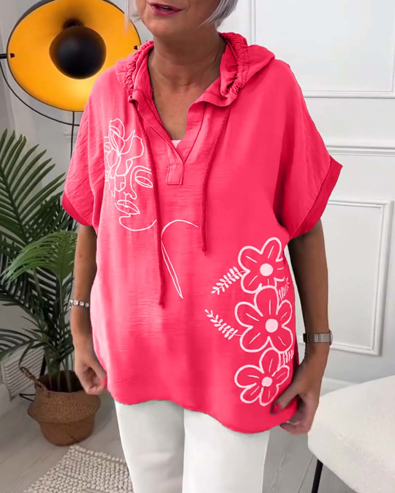 Uformell hettebluse med korte ermer med blomstertrykk