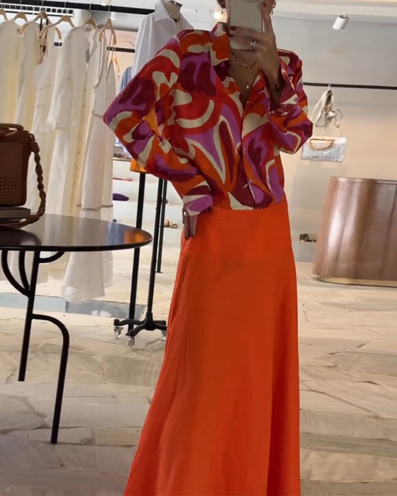 Fargerik bluse med revers og trykk med knapper