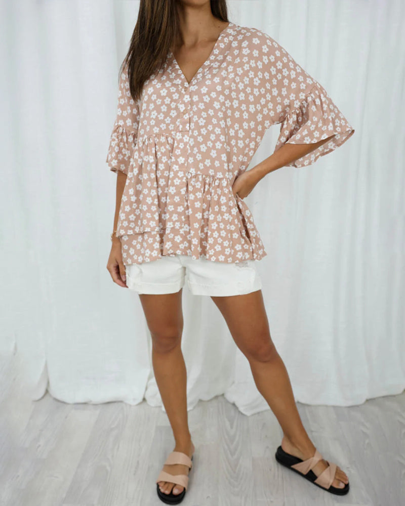 Blomstret bluse med V-hals klokkeermer