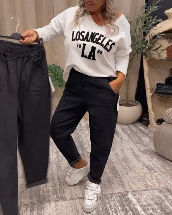 Uformell genser med v-hals med bokstavtrykk