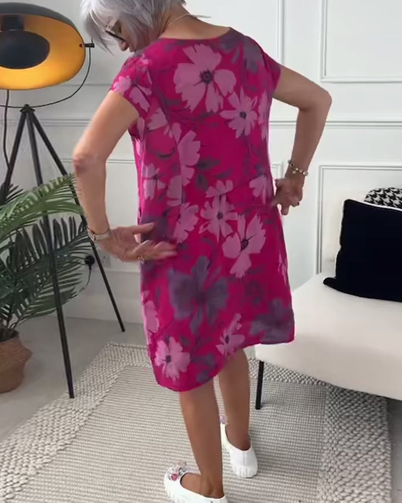 Uformell løs kjole med blomstertrykk med korte ermer og lommer