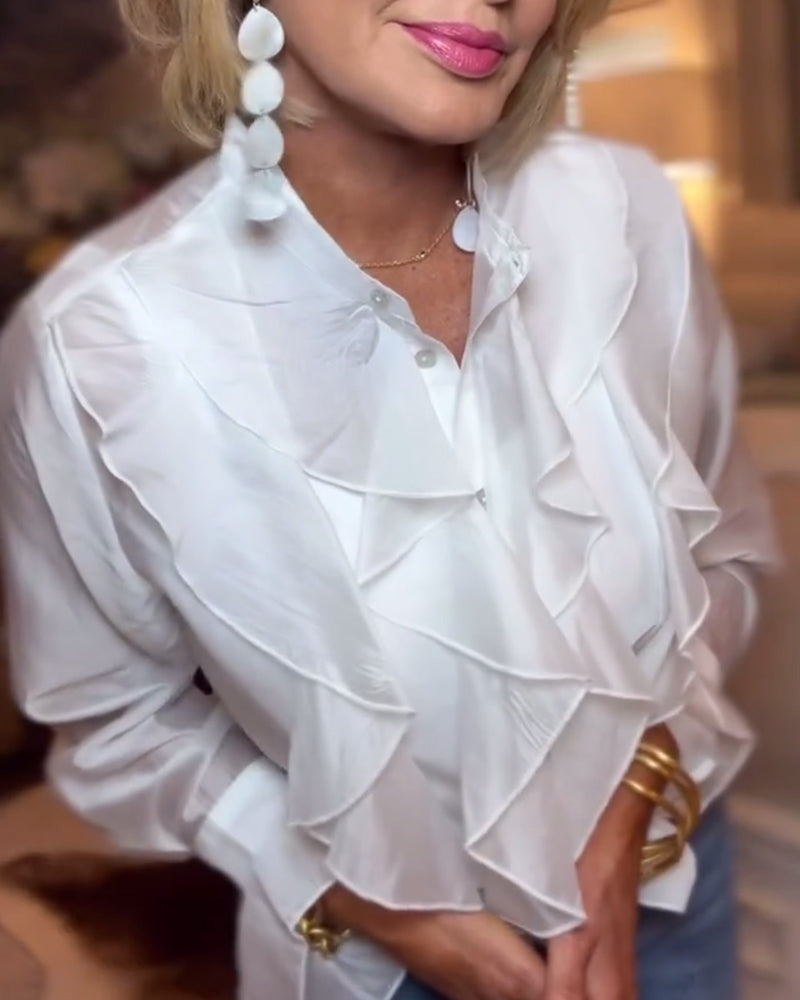 Elegant bluse med ensfarget rysjer