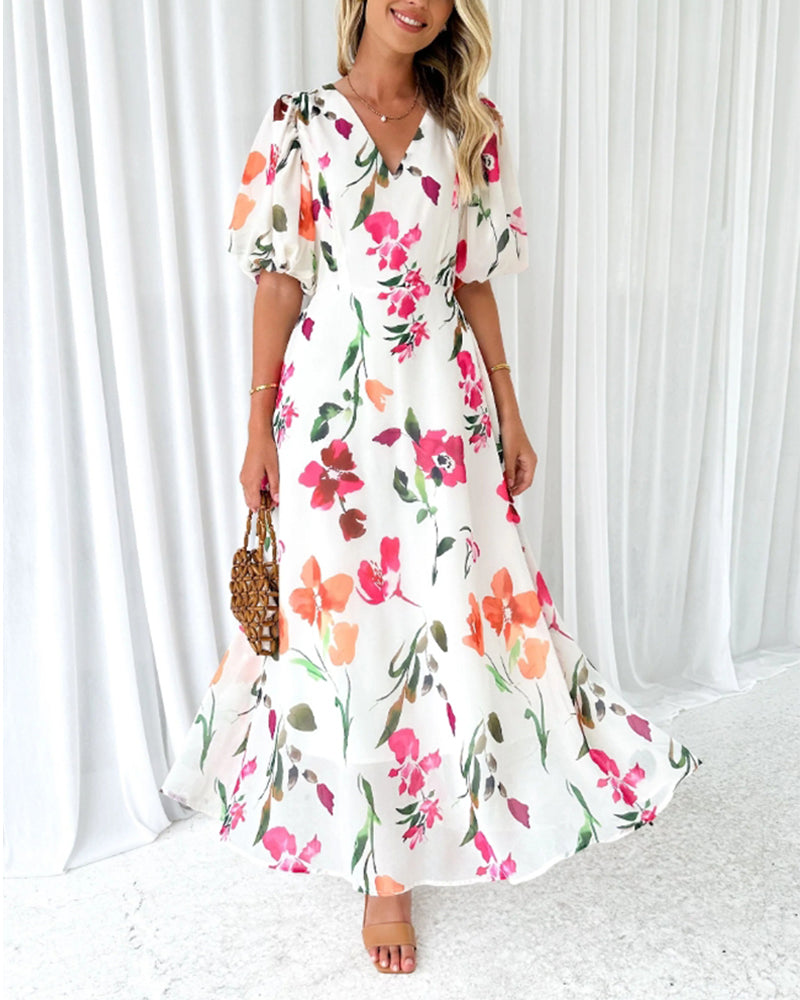 Elegant kjole med puffermer og blomsterprint