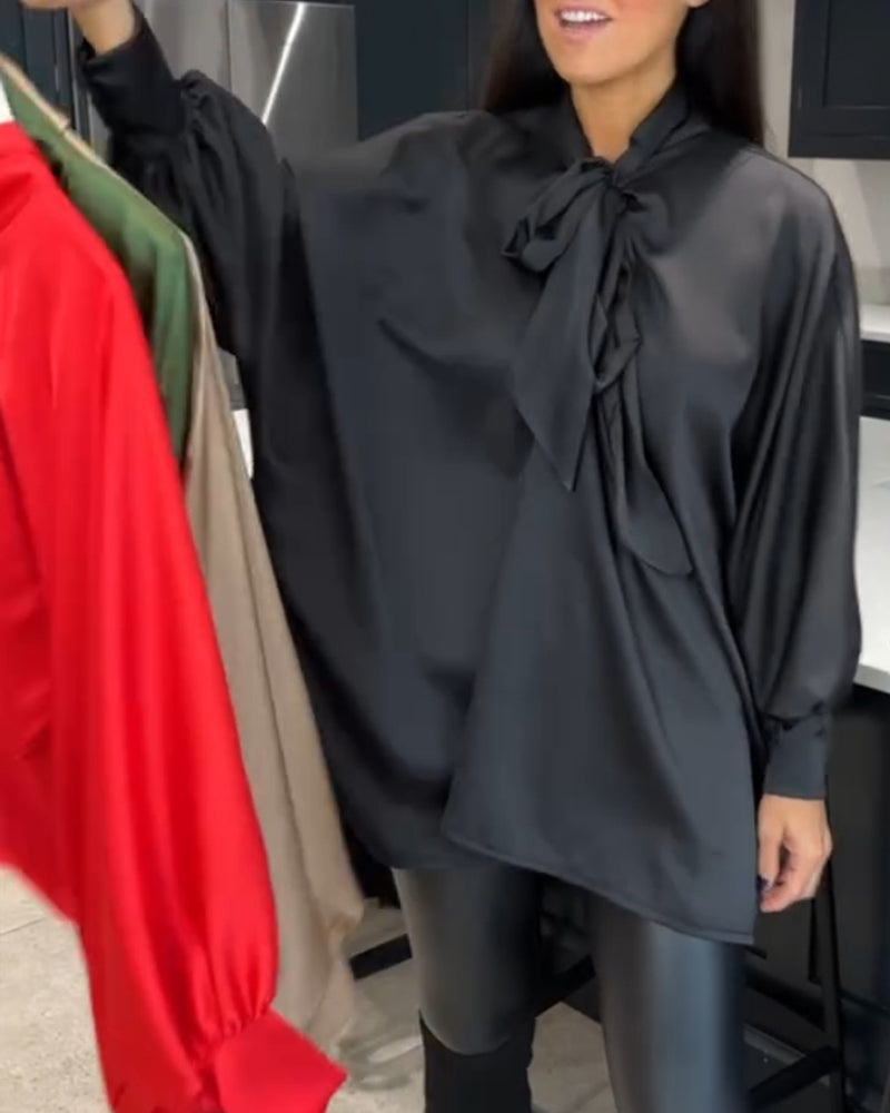 Båndkrage ensfarget og elegant bluse