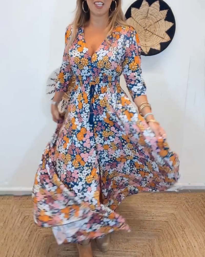 Kjole med dyp V-hals og blomster