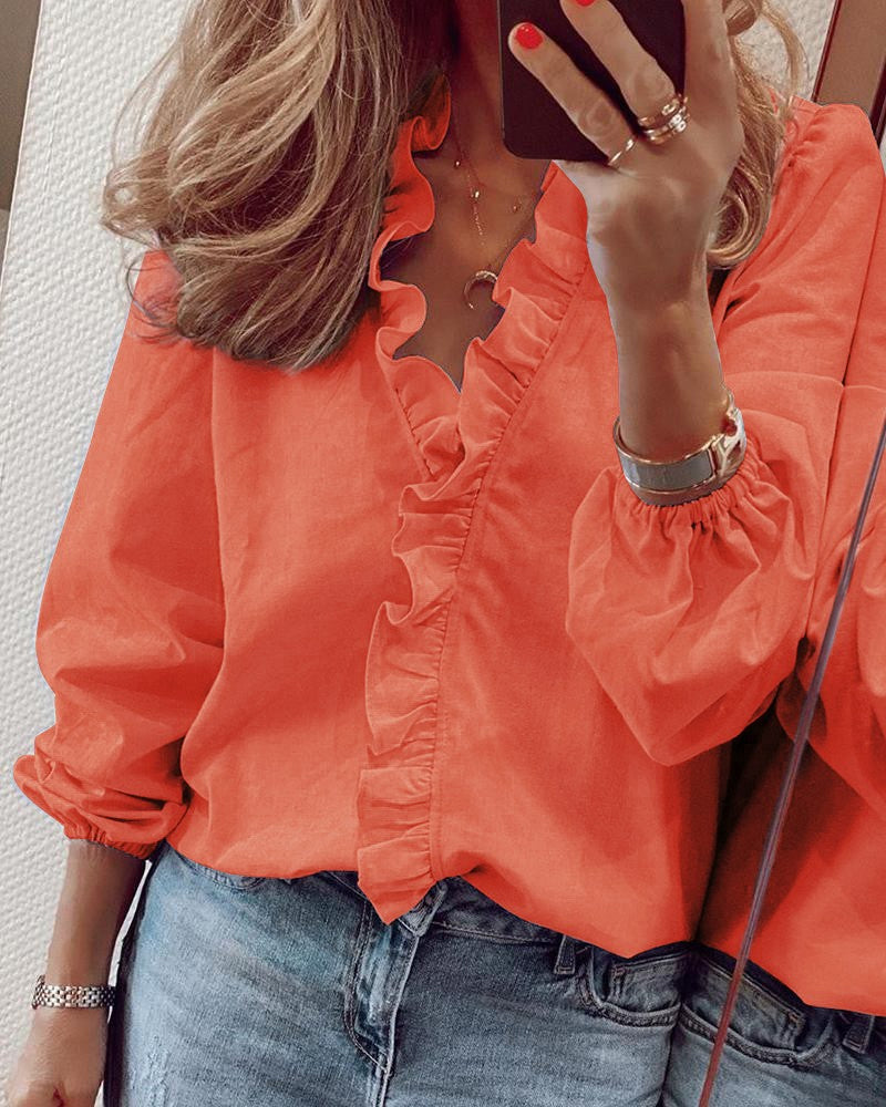 Ensfarget bluse med puffermer
