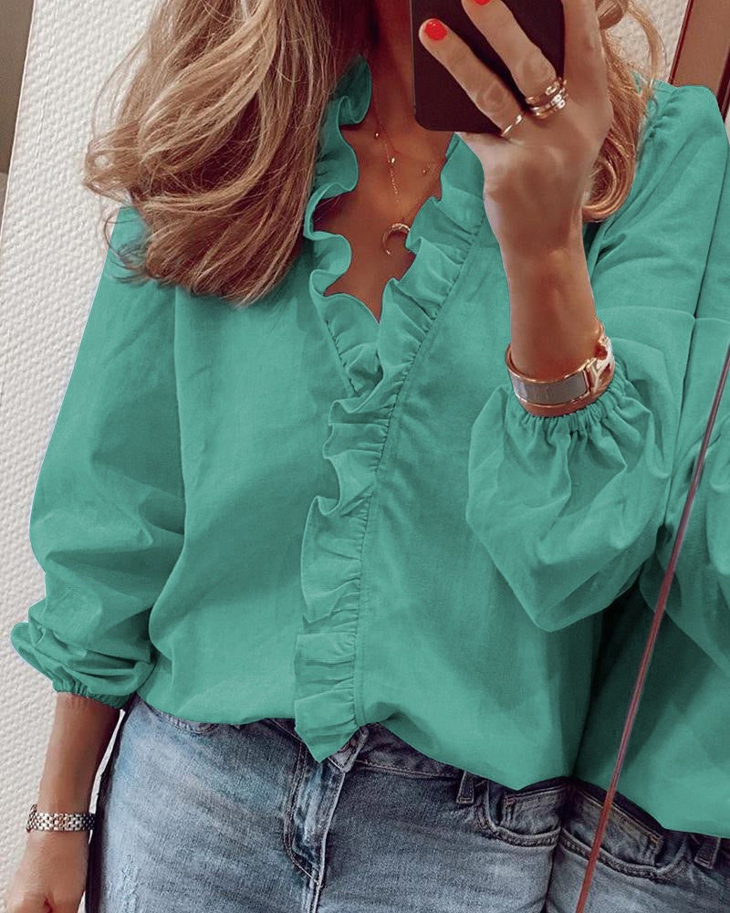 Ensfarget bluse med puffermer