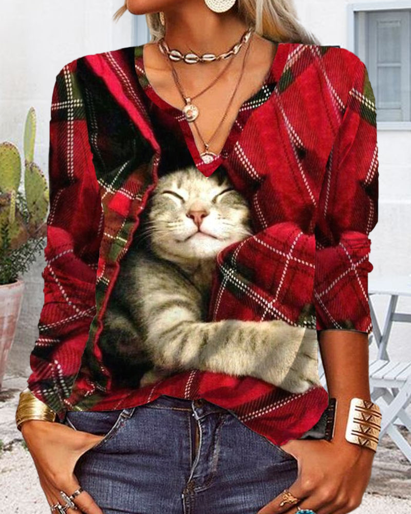 Topp med kattepaneler og lange ermer