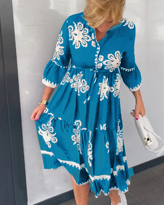 Kjole med blomstertrykk med 3/4-ermer