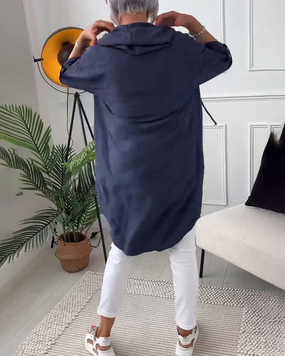 Kåpe med bokstavtrykk med hette