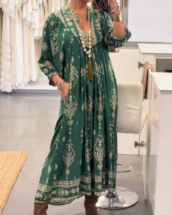 Kjole med avslappet trykk og løse lommer