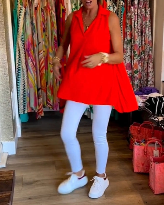 Ermeløs topp med volanger og jakkeslag