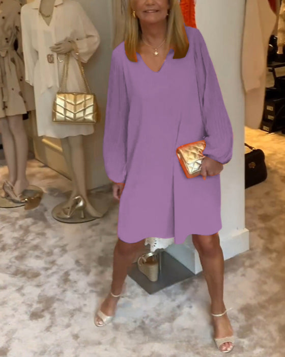 Ensfarget kjole med lanterne med V-hals