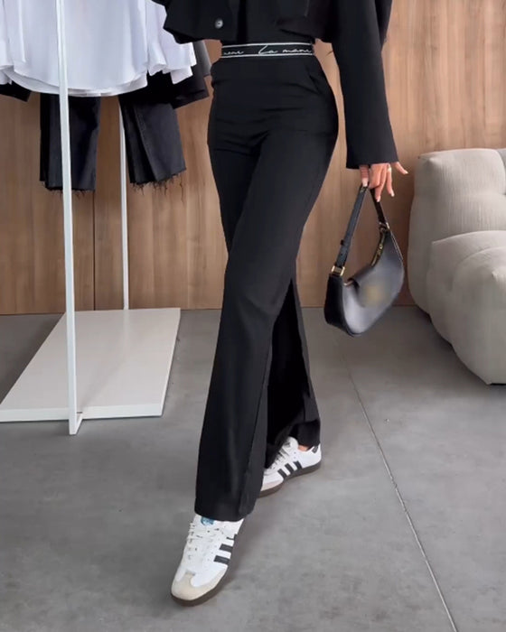 Uformelle ensfargede rette bukser med glidelåslomme