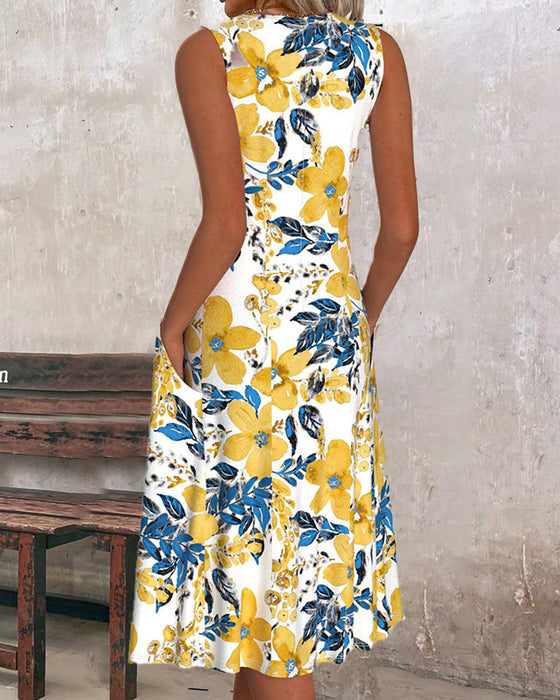 Ermeløs kjole med blomstertrykk og lomme