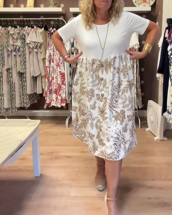 Kjole med avslappet temperament, trykk og rund hals