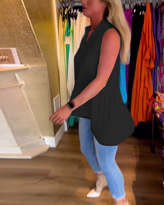 Ermeløs topp med volanger og jakkeslag