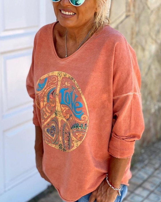 Oransje trykt topp