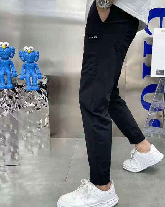 Høystrekkbare skinny cargobukser med flere lommer for menn