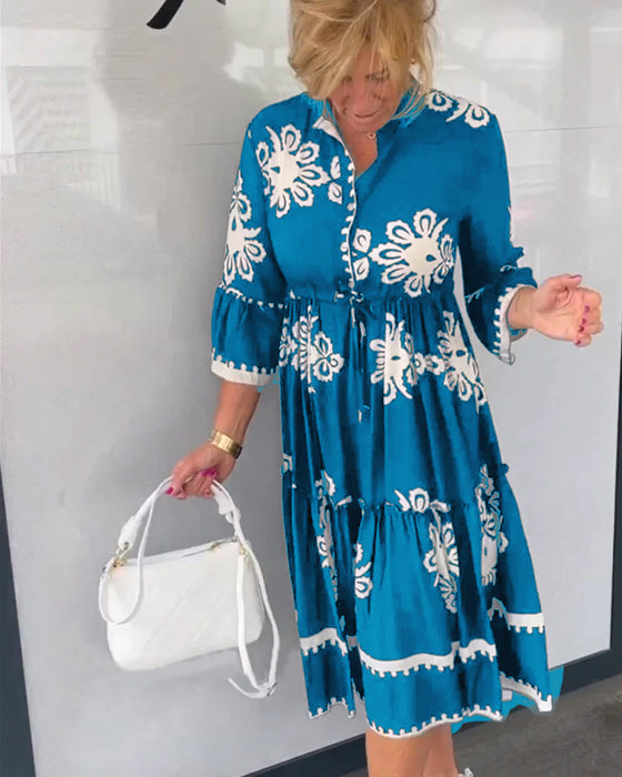 Kjole med blomstertrykk med 3/4-ermer