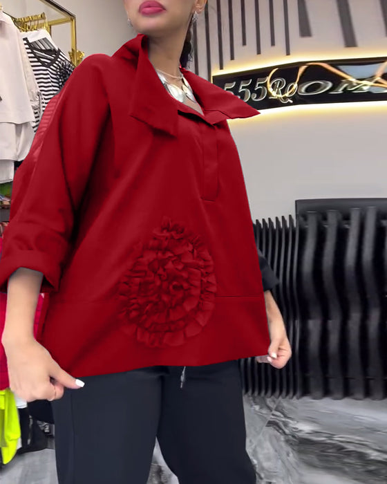 Lapel-blonde med lappeteppe blomsterbluse