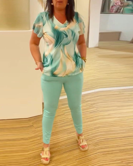 Bluse med V-hals med mønster på ermer med patchwork