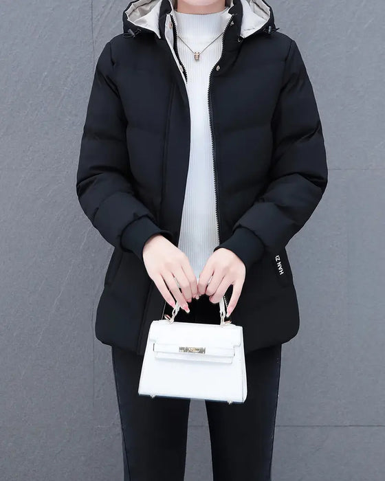 Jakke med varm, avslappet og ensfarget hette