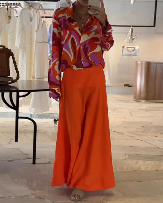 Fargerik bluse med revers og trykk med knapper