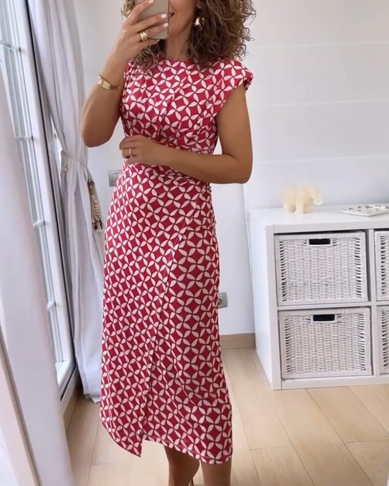 Ermeløs, elegant kjole med geometrisk trykk med rund hals